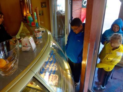 a group of people standing in front of a glass case