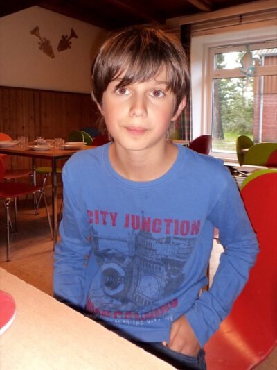 a boy sitting at a table