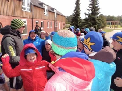 a group of people in winter clothes
