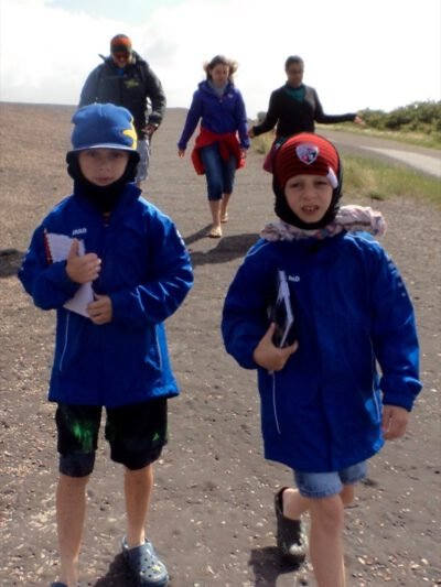 a group of children walking on a road