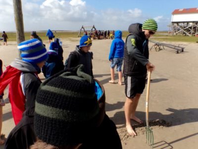 a group of people on a beach