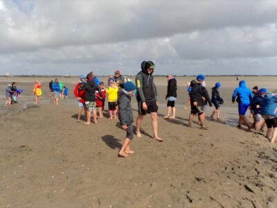 a group of people on a beach