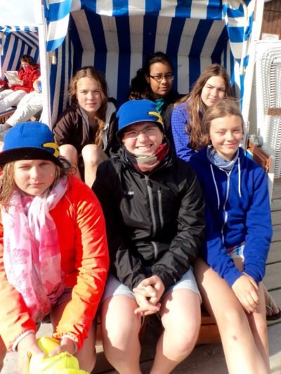 a group of people sitting in a chair