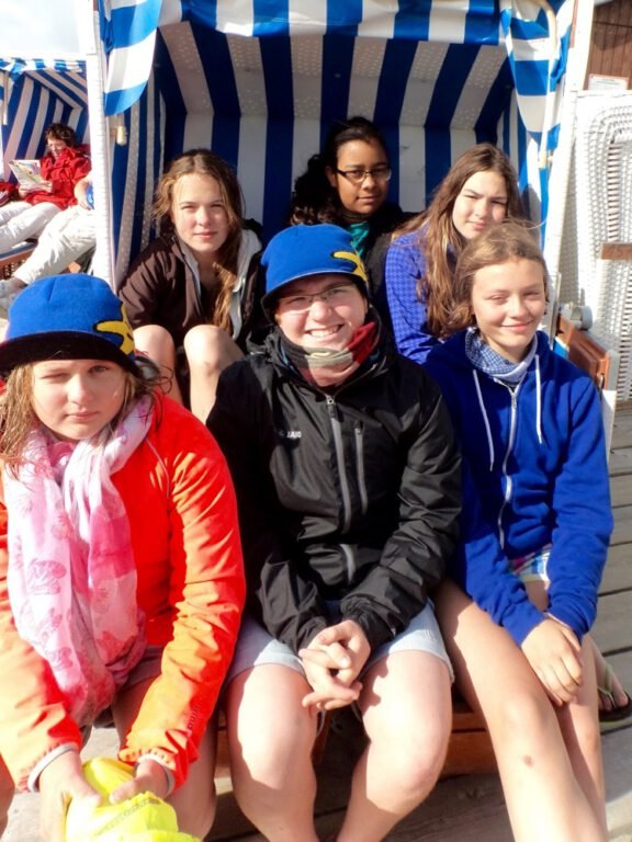 a group of people sitting in a chair