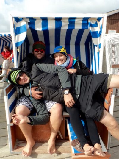 a group of people sitting in a beach chair