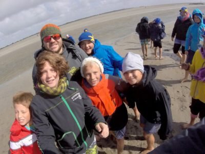 a group of people on a beach