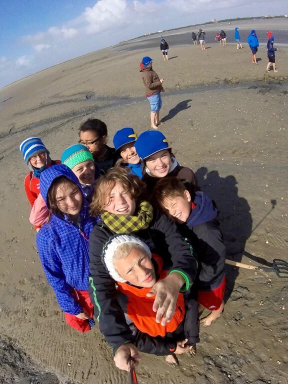 a group of children on a beach