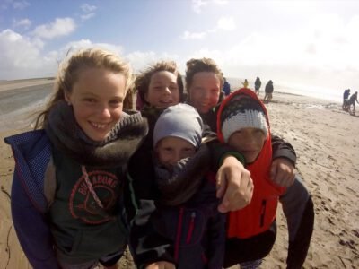 a group of children on a beach