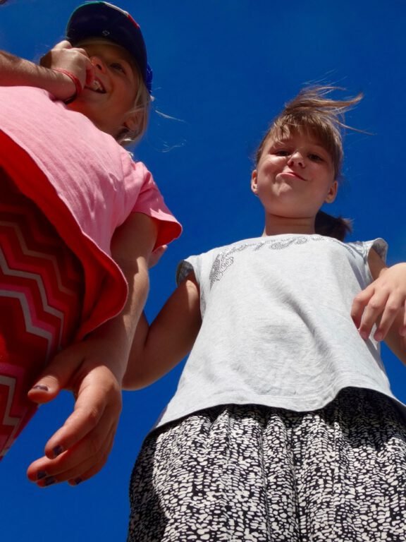 two girls standing together and smiling