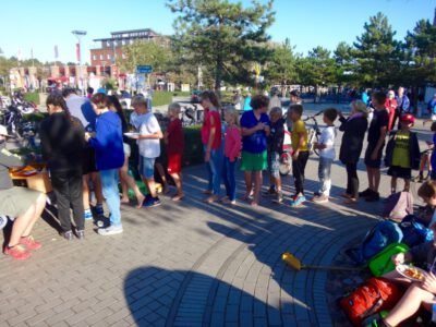 a group of people standing on a brick path