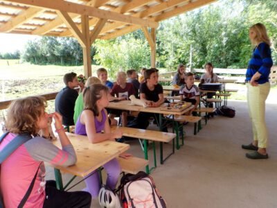 a group of children sitting at tables