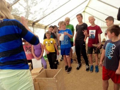 a group of people standing in a tent