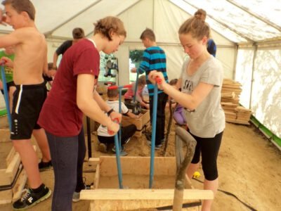 a group of people working in a tent