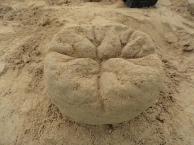 a round object made of sand