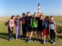 a group of kids posing for a photo