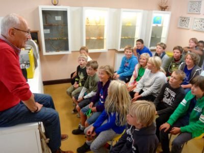 a group of children sitting in a room