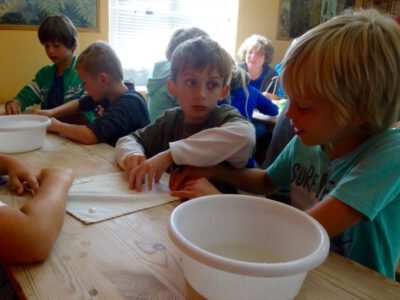 a group of kids sitting at a table