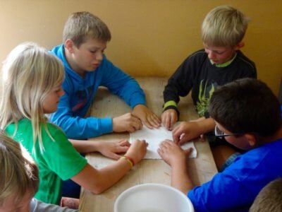 a group of kids sitting at a table