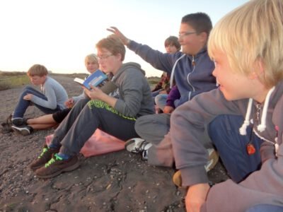 a group of people sitting on the ground