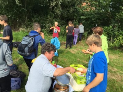 a group of people outside eating food