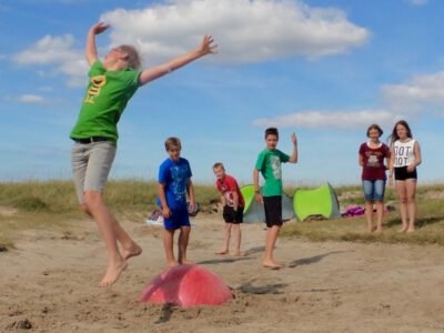 a group of people on a beach