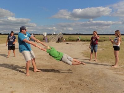 a man holding a child in the air