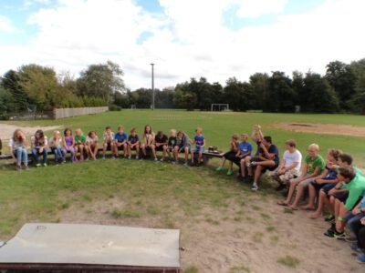 a group of people sitting on a bench