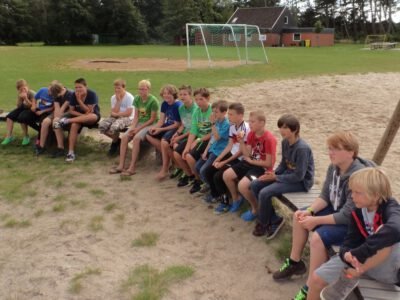 a group of people sitting on a bench