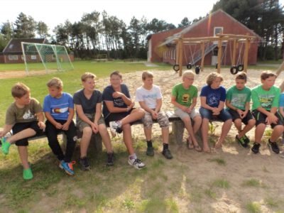 a group of people sitting on a bench