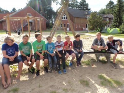a group of people sitting on a bench