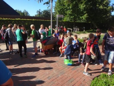a group of kids outside on a brick path