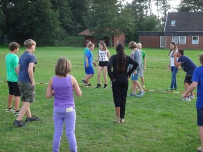 a group of people standing on grass