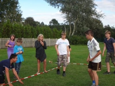 a group of kids playing in a field