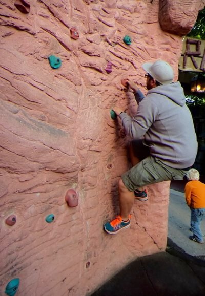 a man climbing a rock wall