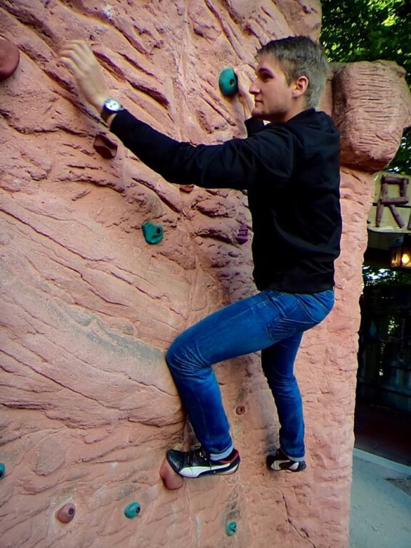 a man climbing a rock wall