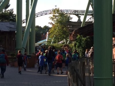 a group of people walking down a path